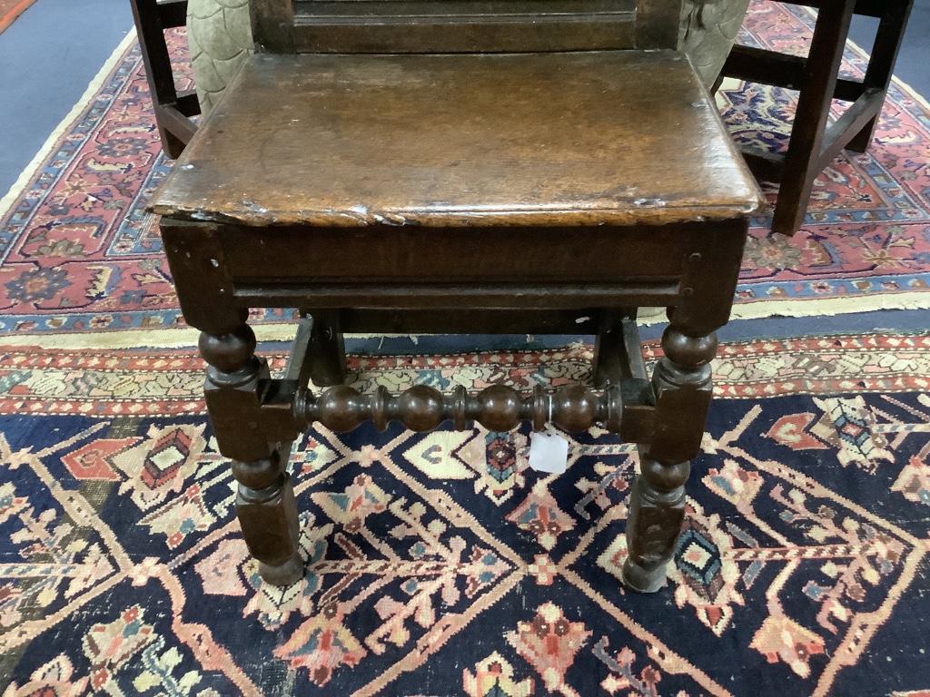 A 17th century oak back stool with lozenge carved decoration, width 48cm, depth 41cm, height 98cm